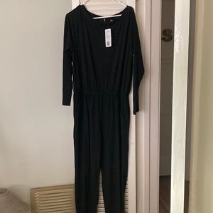 Black long sleeved jumpsuit. NWT. Size XL